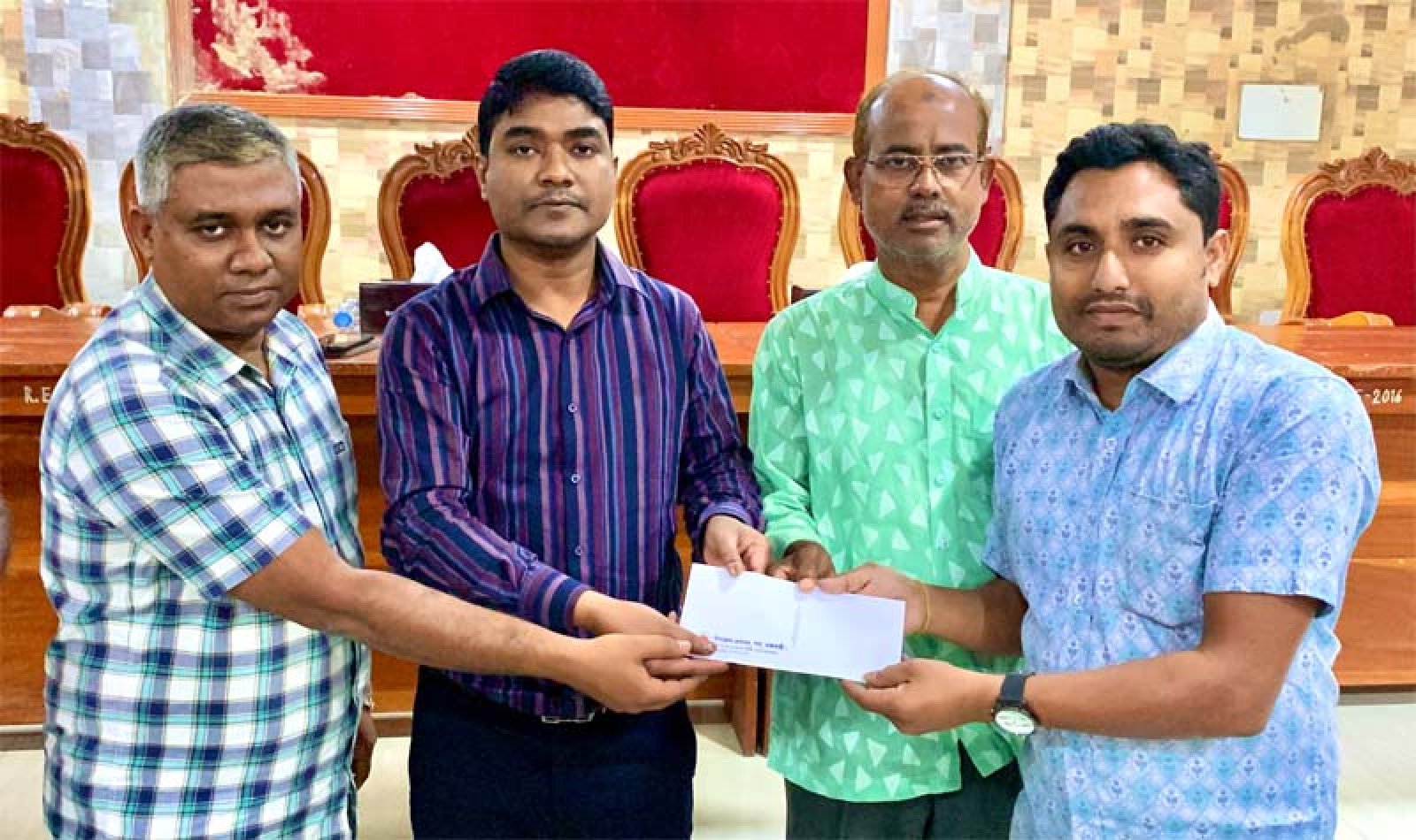 পবায় শারদীয় দুর্গোৎসব উপলক্ষে আর্থিক অনুদান বিতরণ